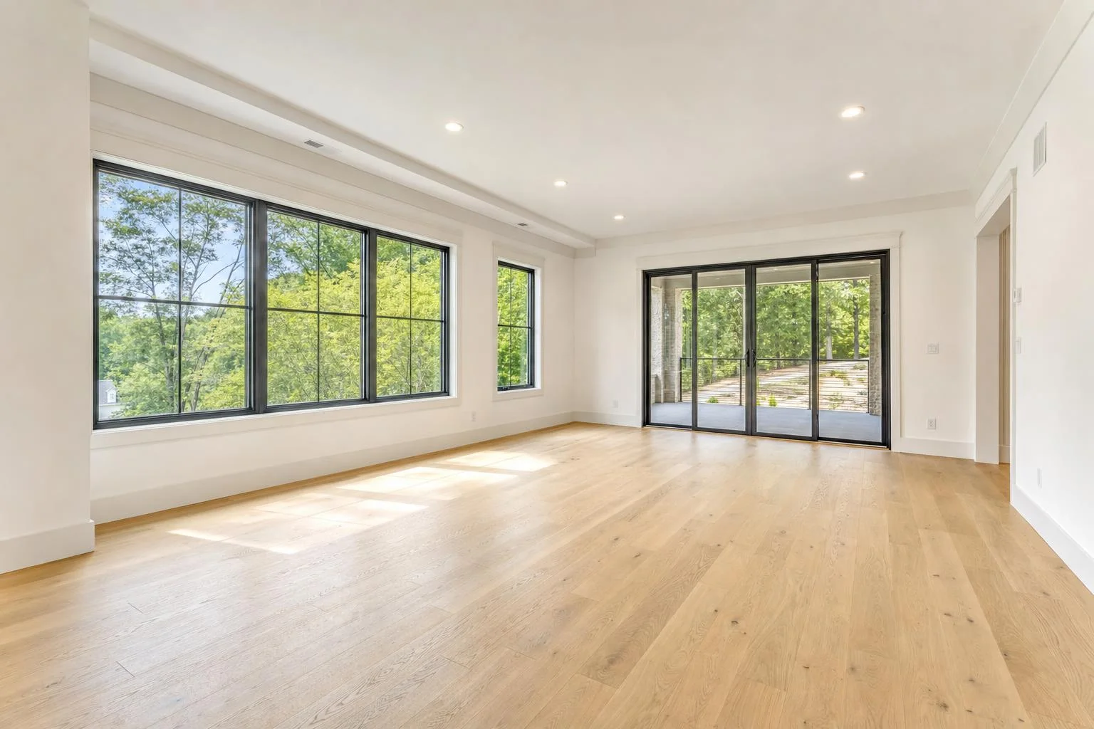 A vacant living room virtually staged into a warm modern living room — empty room before staging